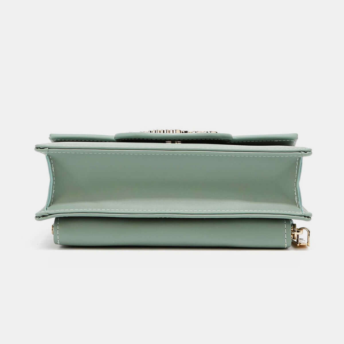 Side view of Nicole Lee USA Small Crossbody Wallet in green vegan leather with removable strap compartmentalized for phone and wallet.