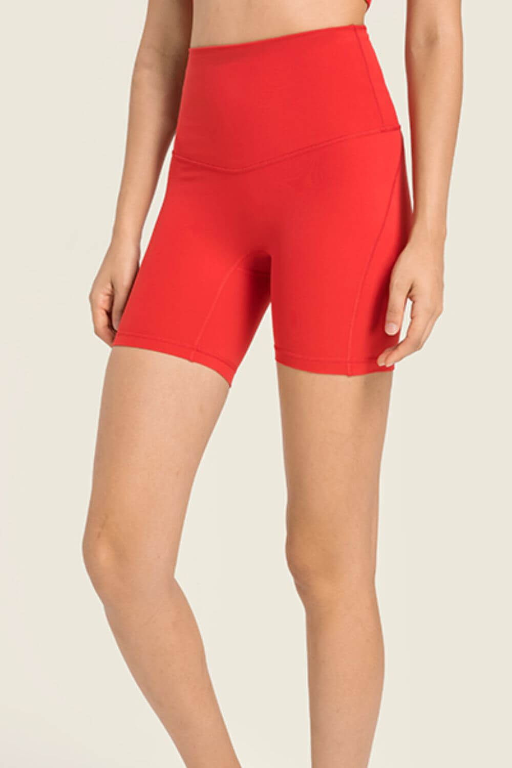 Millennia seamless high-rise wide waistband biker shorts in vibrant red, perfect for comfort and style.