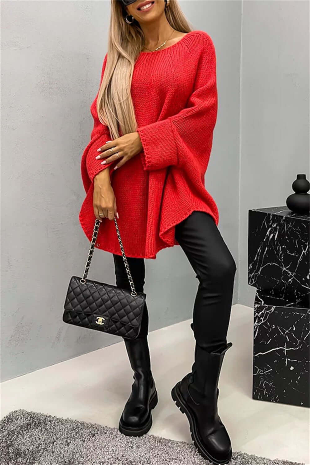 Cozy Bella Road red batwing sleeve sweater paired with black leggings and boots, styled for a fashionable and warm look.