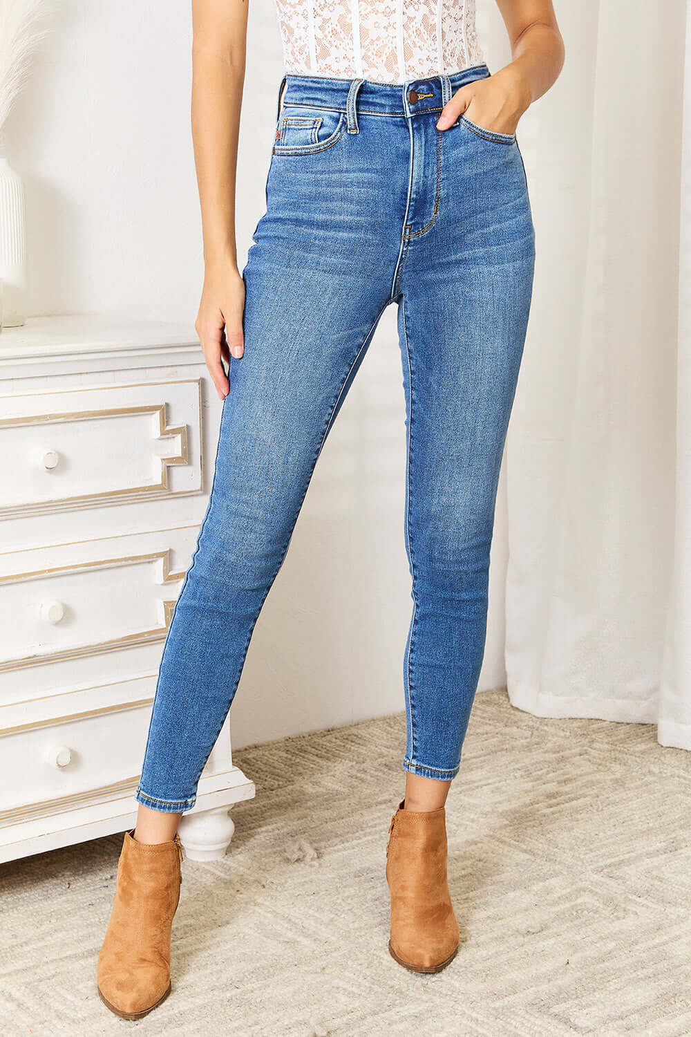 Judy Blue high waist skinny jeans in medium ash wash, flattering fit, slightly stretchy, clean look, model wearing brown suede boots