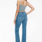 Model showcasing bytos Raw Hem Distressed Mid Rise Crop Jeans from the back, highlighting the stylish raw hem and fitted design.