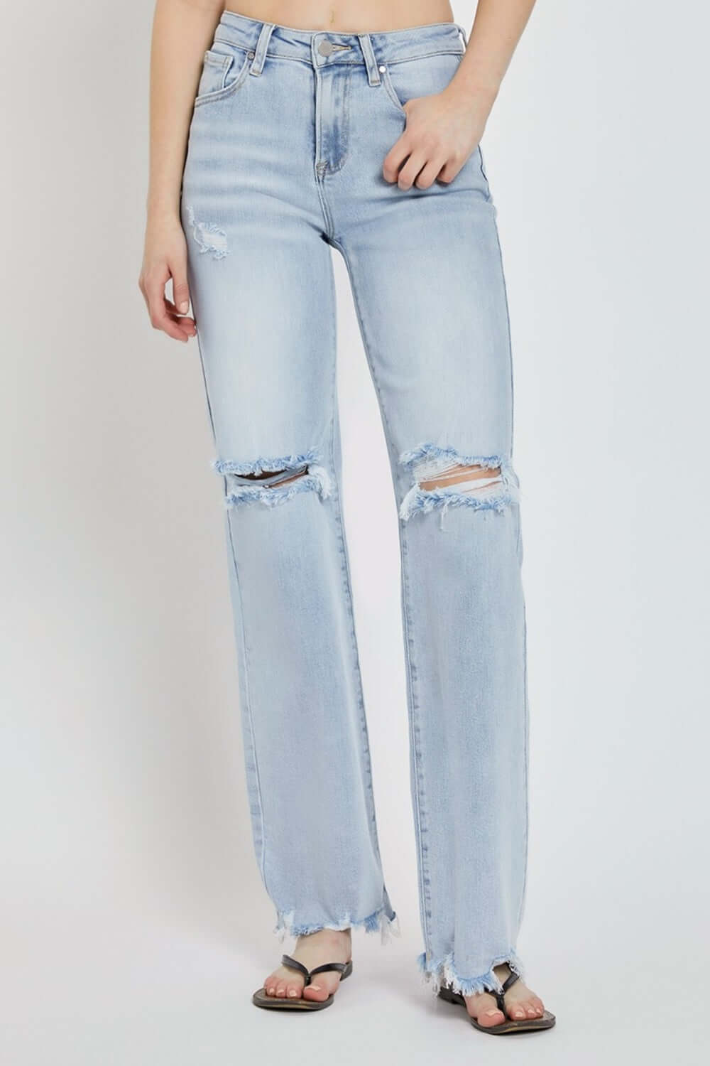 High rise distressed wide leg Risen Jeans with chic and edgy detailing for a trendy, fashion-forward look.