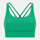 Millennia Crisscross Scoop Neck Active Tank in vibrant green, featuring stylish crisscross straps and a sleek, comfortable design.