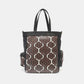 Nicole Lee USA geometric pattern tote bag with edgy exotic accents and multiple compartments, made of vegan leather.