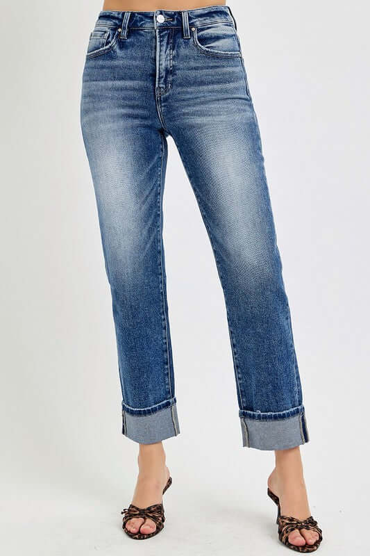 Crop straight roll up jeans in medium blue wash, featuring a high rise waist and stylish rolled hem.