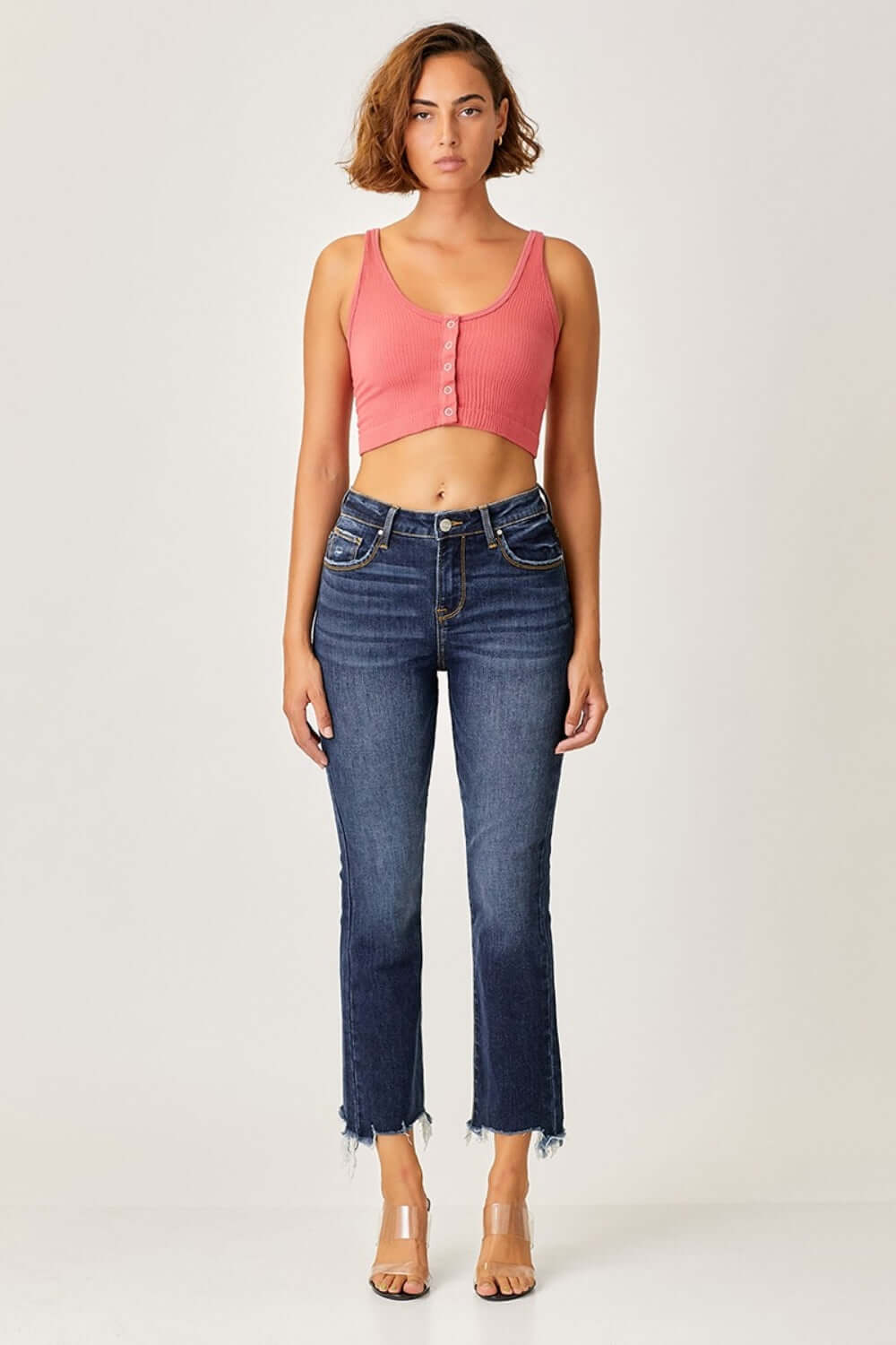 Frayed Hem Cropped Straight Jeans | Petite - Model wearing trendy Risen Jeans with frayed hem, showcasing a chic casual look with pink top.