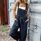 Stylish woman wearing Bella Road Plaid Wide Strap Wide Leg Overalls, perfect for a trendy and comfortable look.