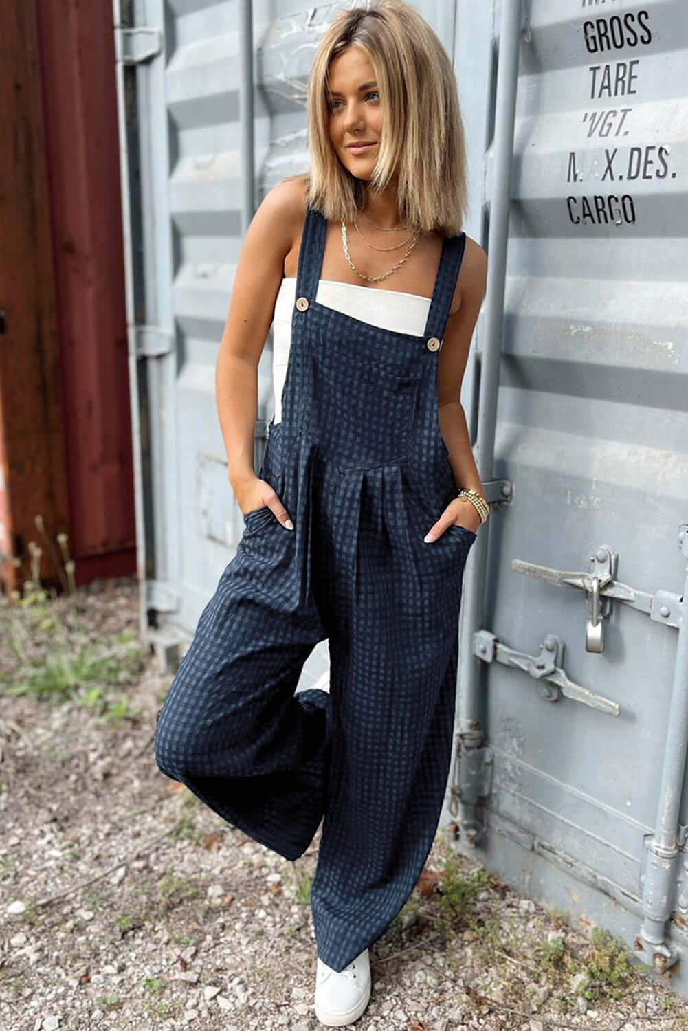 Stylish woman wearing Bella Road Plaid Wide Strap Wide Leg Overalls, perfect for a trendy and comfortable look.