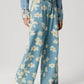 Bella Road floral wide leg jeans with pockets, showcasing a playful blue floral pattern perfect for trendy outfits.