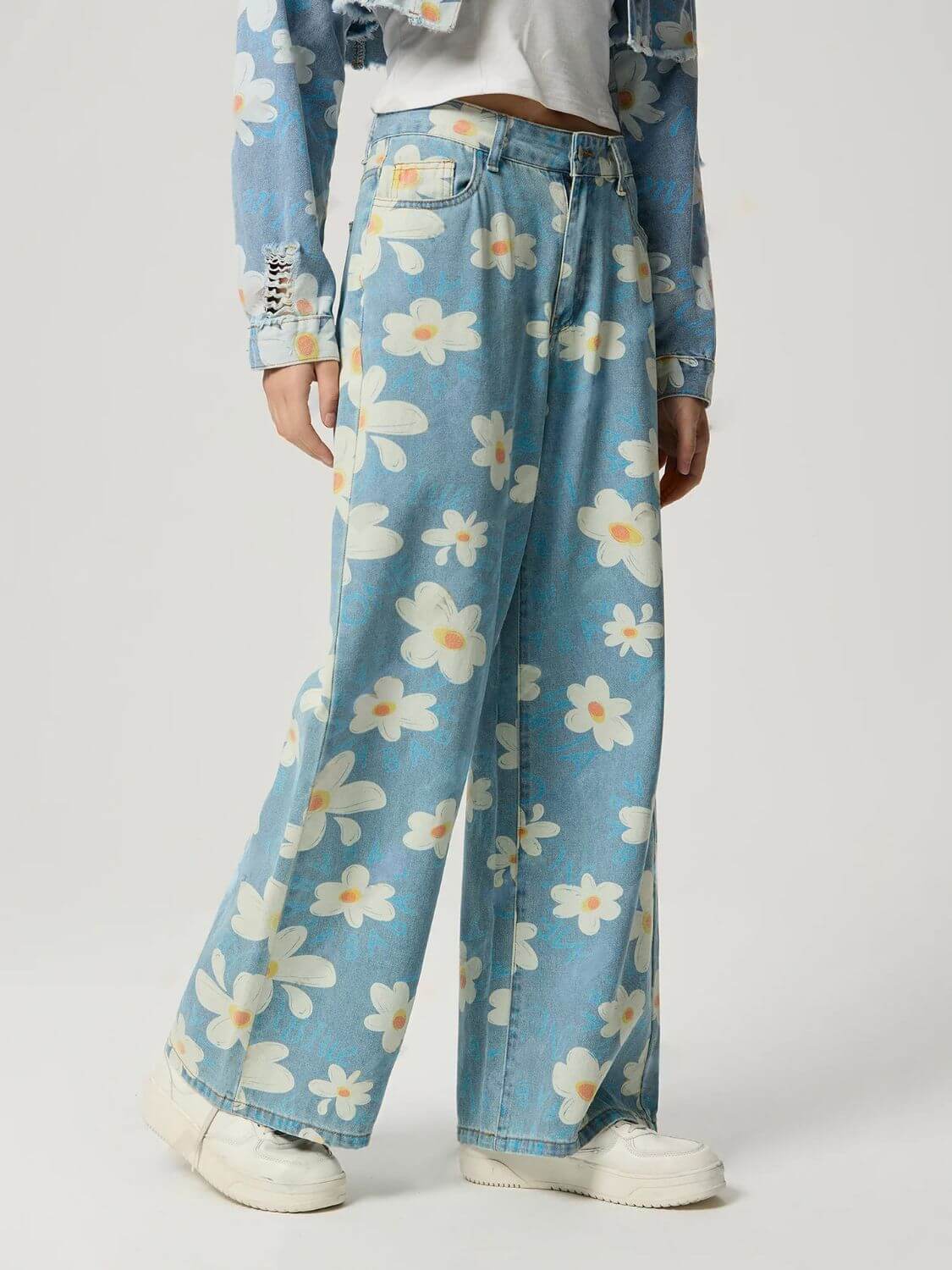 Bella Road floral wide leg jeans with pockets, showcasing a playful blue floral pattern perfect for trendy outfits.