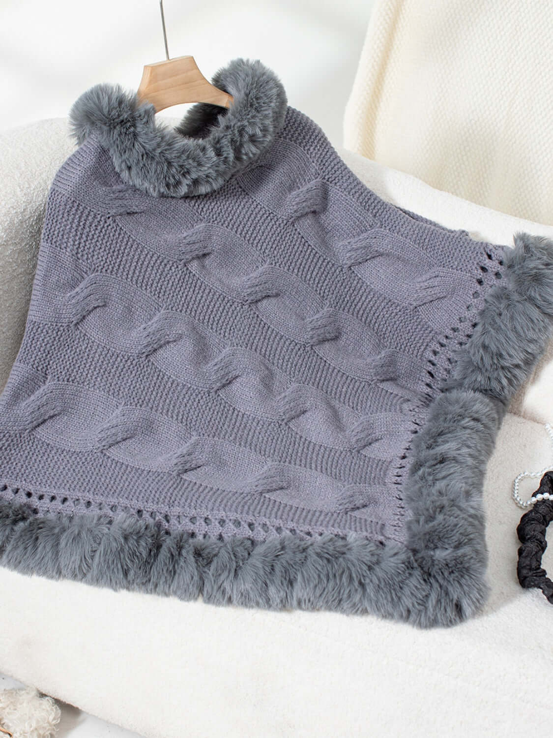 Cozy gray Bella Road Fuzzy Hem Cable-Knit Poncho with a fluffy hem, perfect for chilly days.