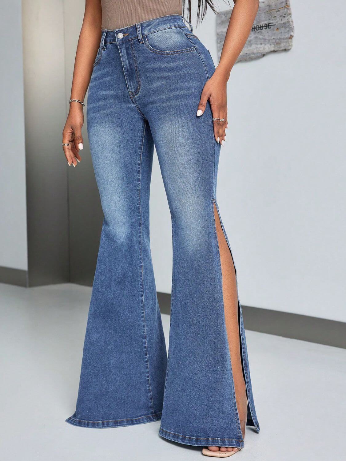 Woman wearing slit flare jeans with pockets, featuring a button closure and highly stretchy fabric for comfort and style.