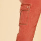 Close-up of cargo pocket on Annie Wear straight leg jeans, showcasing stylish design and practical storage.