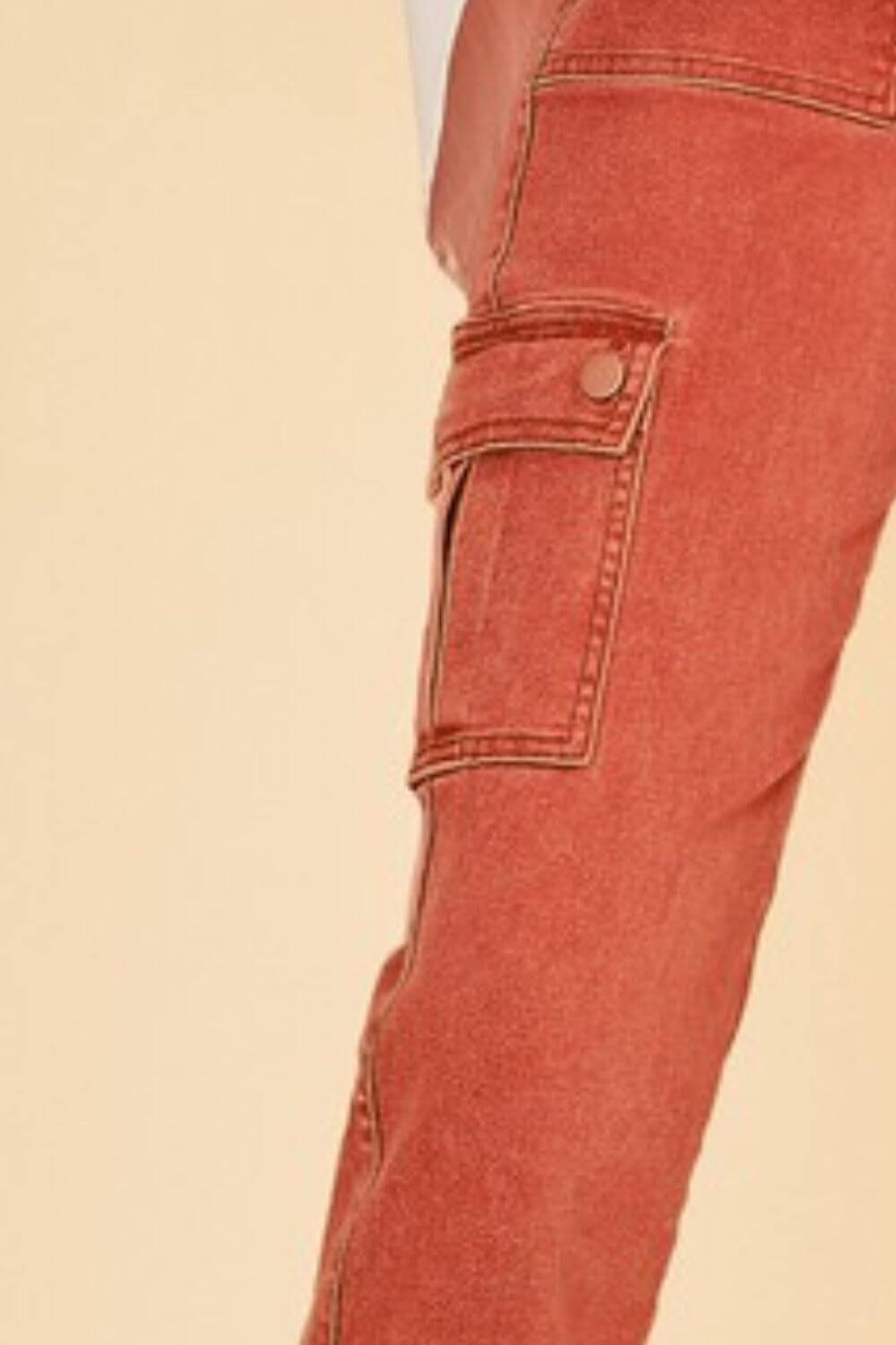 Close-up of cargo pocket on Annie Wear straight leg jeans, showcasing stylish design and practical storage.