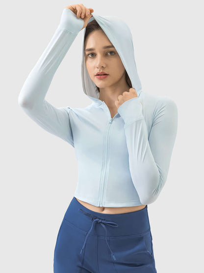 Model wearing light blue Millennia Zip Up Hooded Long Sleeve Active Outerwear, showcasing its stylish and functional design.