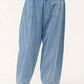 Back view of elastic waistband pleated baggy jeans in light denim, featuring pocket details and relaxed fit.