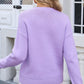 Woman wearing a lavender Angel Wings Bow Graphic Round Neck Long Sleeve Sweater seen from the back.