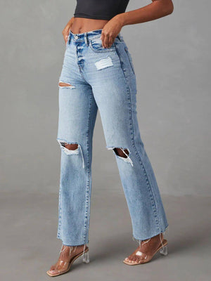 Bella Road distressed straight leg jeans with pockets shown on model, featuring ripped knees and button details, made of cotton and polyester.