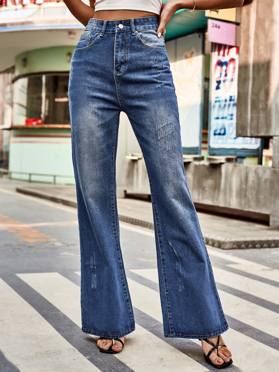 Bella Road High Rise Bootcut Jeans with Pockets in urban setting, flattering fit, trendy style, perfect for casual or night out.