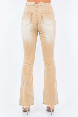 Back view of American Bazi V-Cut Ruched Flare Pants in beige with flare leg and pocket details.