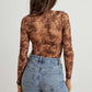 TASHA APPAREL Abstract Mesh Lace-Up Long Sleeve Bodysuit at Bella Road