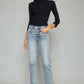 Woman wearing High Waist Button Fly Raw Hem Cropped Straight Jeans, stylish vintage-inspired look with a flattering high waist and edgy raw hem detailing.