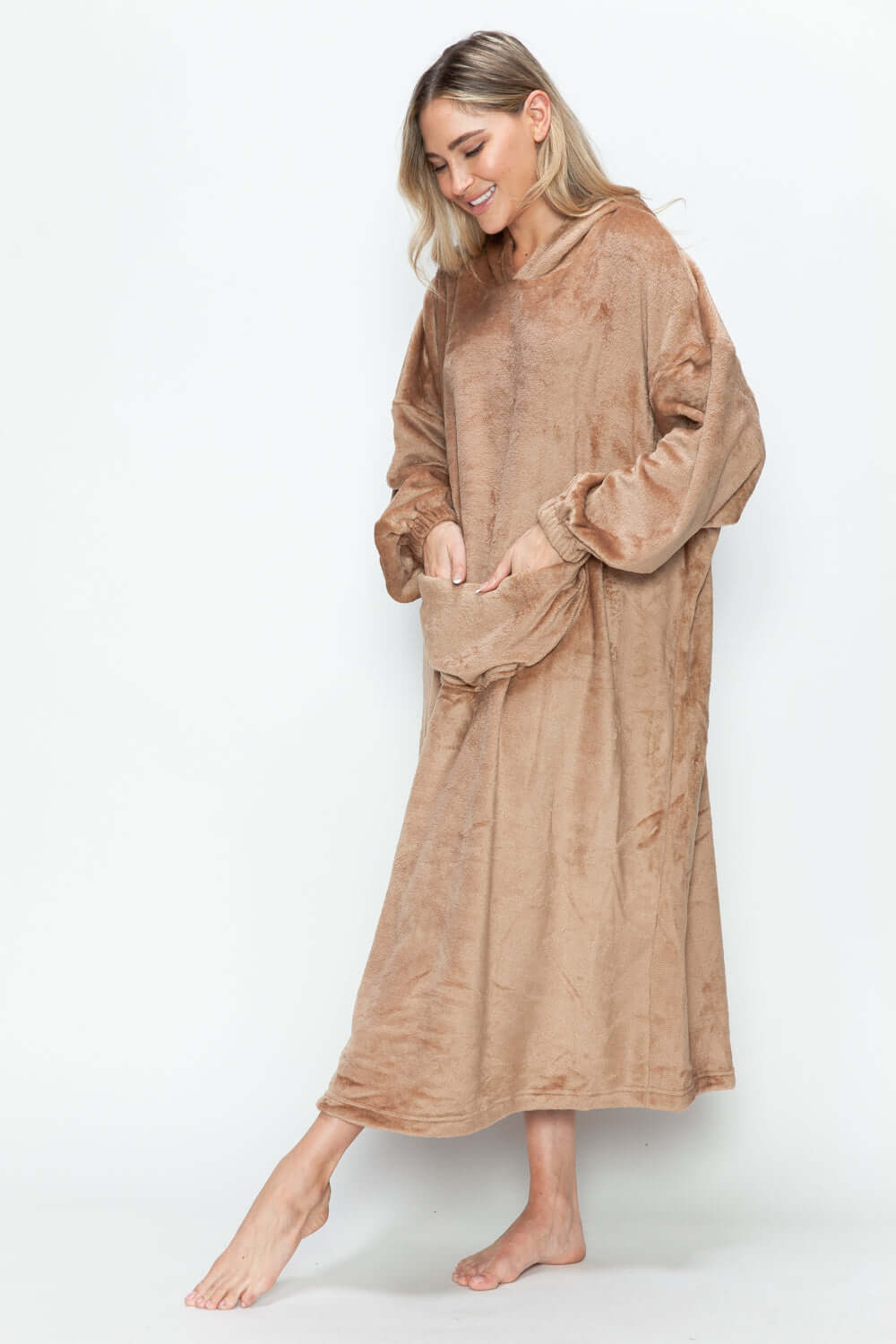 Cozy hooded midi lounge dress in warm beige, featuring pockets and a relaxed fit for stylish comfort at home.