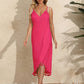 Woman wearing a pink backless tassel surplice spaghetti strap cover up dress made of 100% polyester.