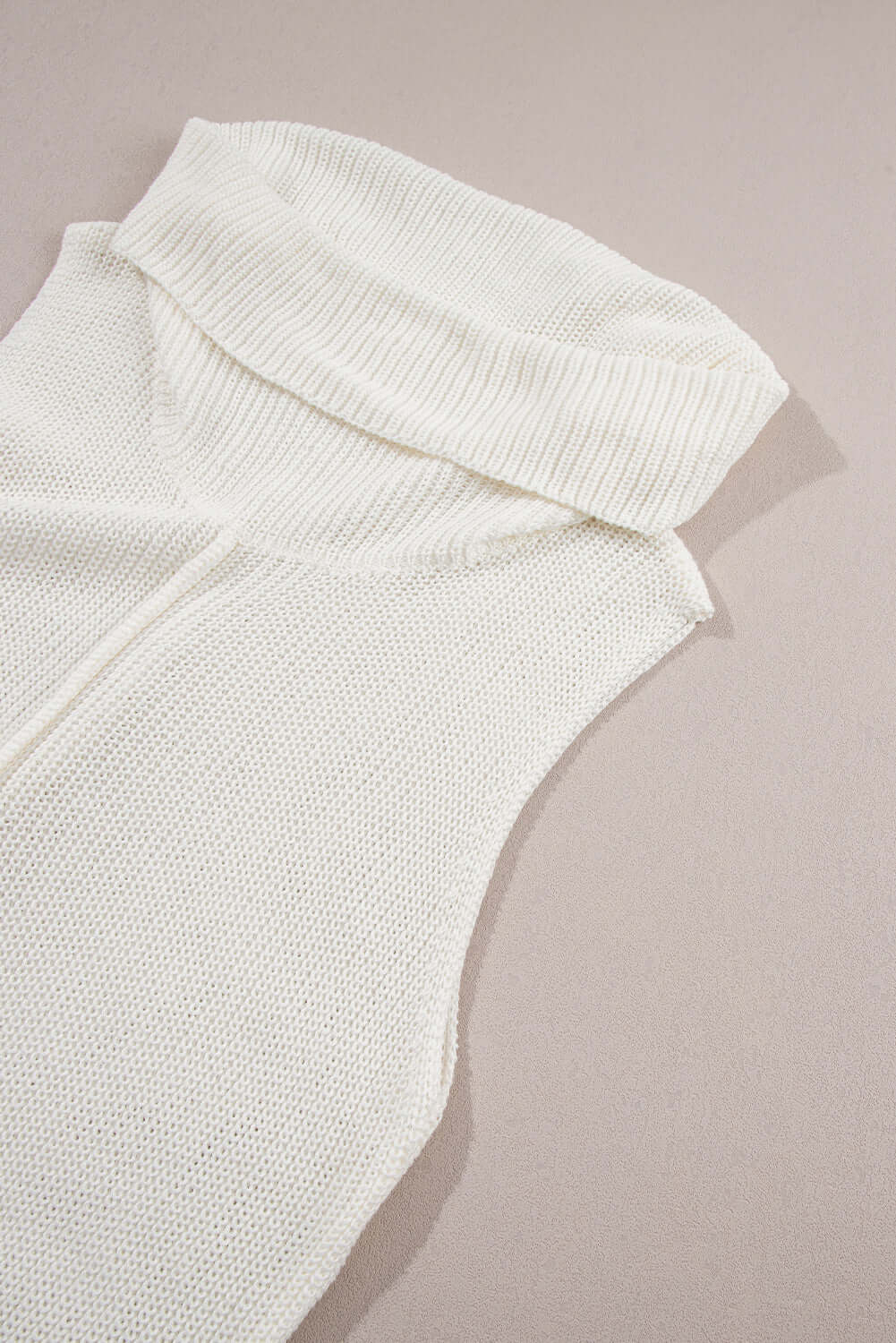 Bella Road sleeveless turtleneck sweater vest in white, featuring a cozy central seam perfect for layering.