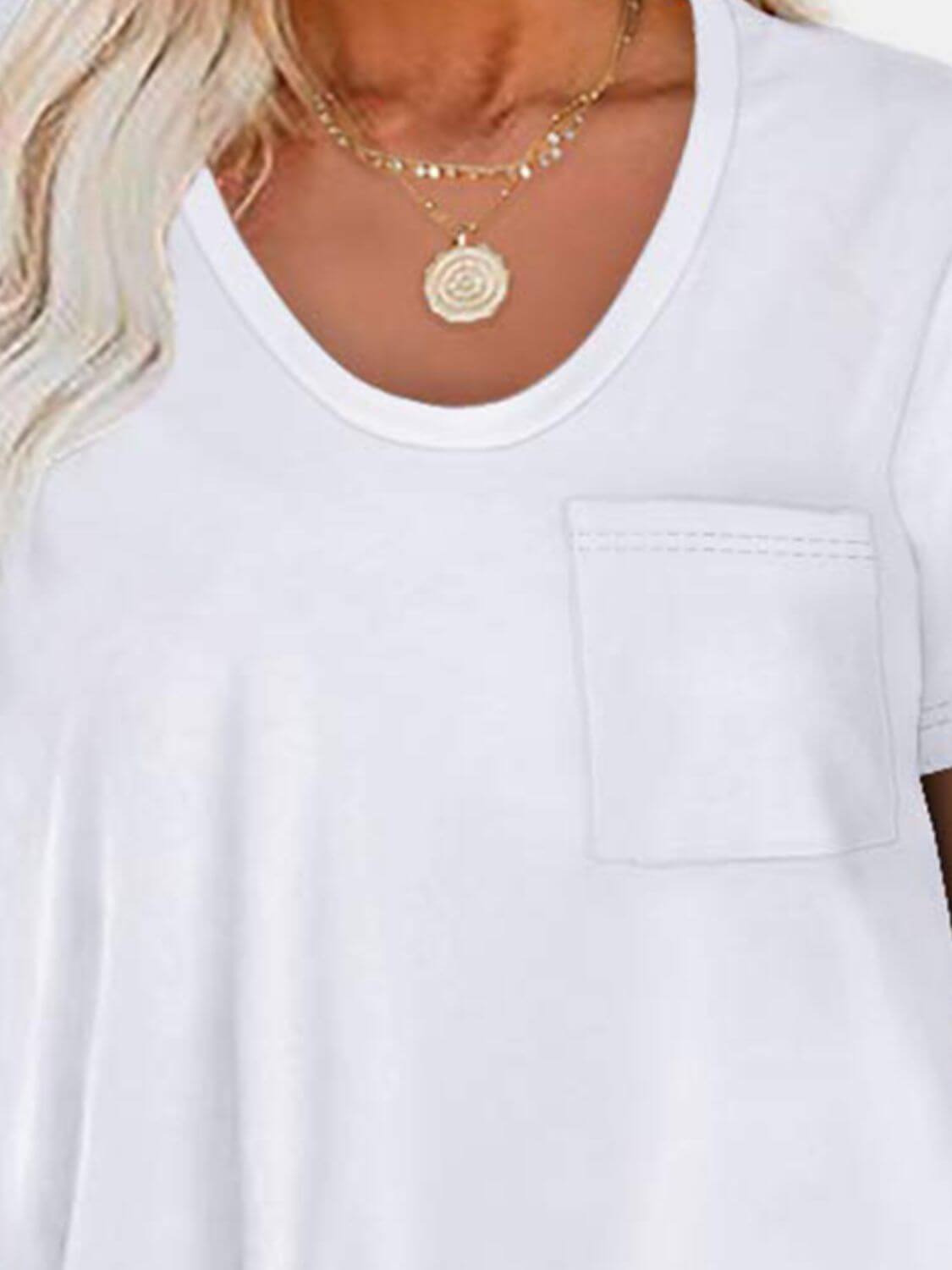 Woman wearing Bella Road round neck long sleeve t-shirt with pocket detail and gold necklace.