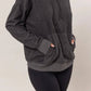 Cozy black brushed long sleeve hoodie with kangaroo pocket, perfect for casual outings and chilly days.