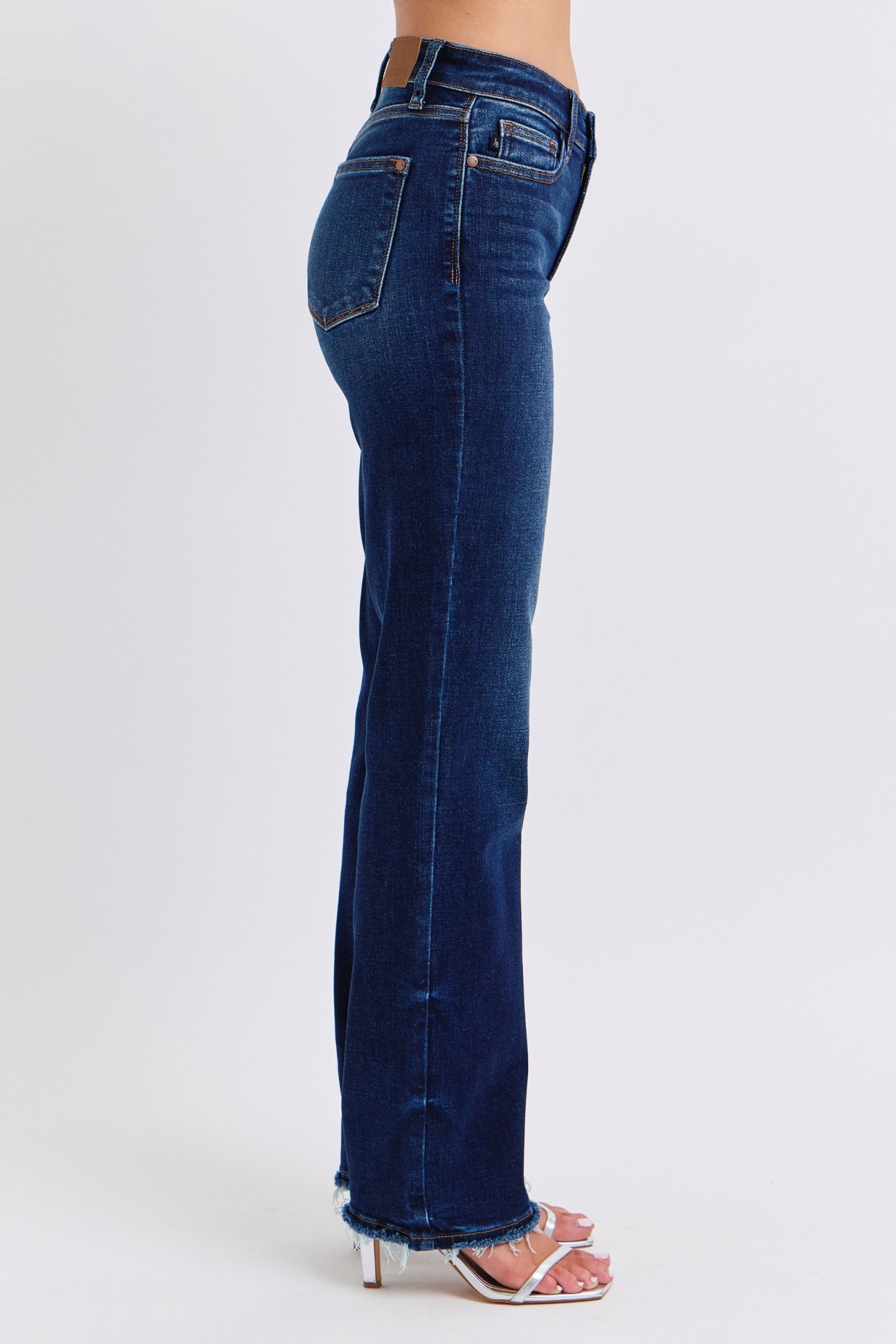 Judy Blue raw hem straight leg jeans side view showcasing versatile and stylish denim with flattering silhouette.