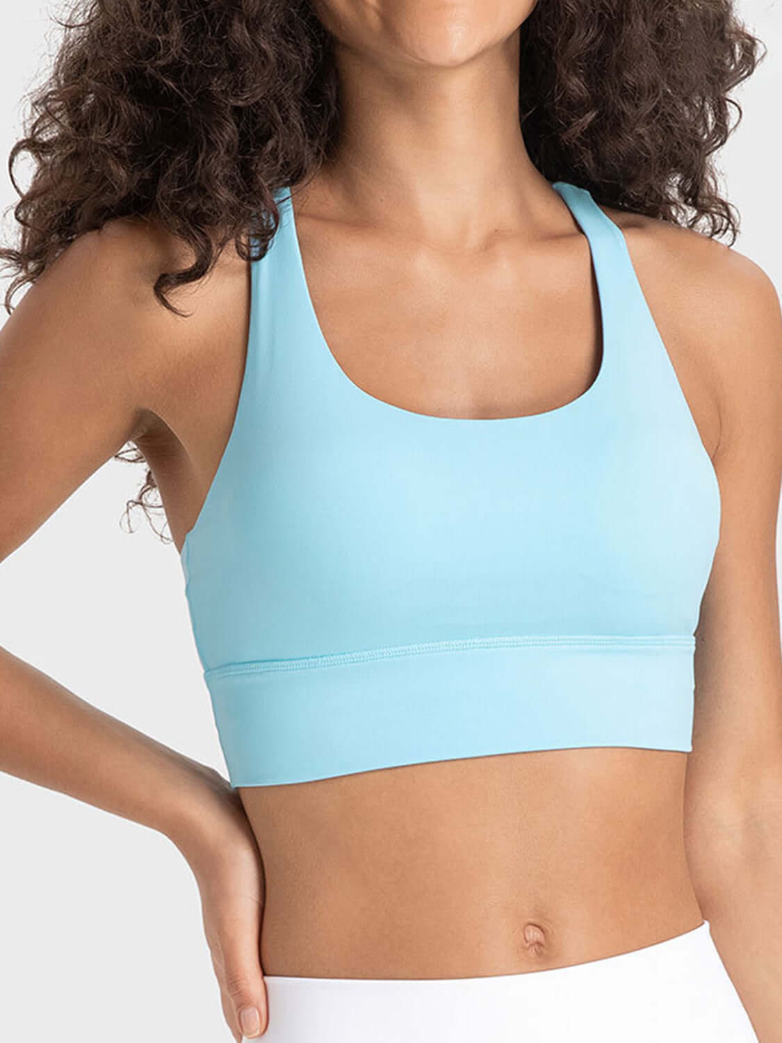 Stylish blue crisscross scoop neck active tank, perfect for workouts and training sessions. Highly stretchy and breathable design.