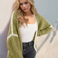 Trendy open front dropped shoulder cardigan in green with white contrast, perfect for stylish comfort and relaxed chic look.