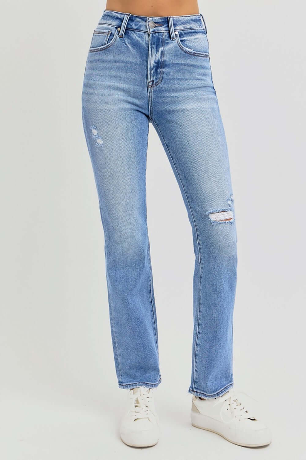 Distressed high-rise ankle straight jeans in light blue denim with a trendy, vintage vibe, perfect for casual or dressed-up outfits.