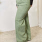 Raw Hem Wide-Leg Risen Jeans in green, high-waisted and pocketed, flattering fit, versatile casual to dressy style, made of cotton and spandex.