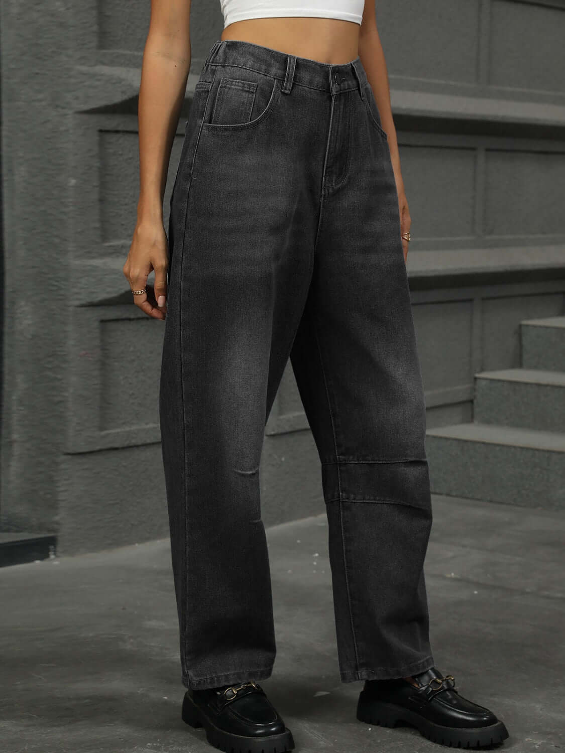 Woman wearing black Half Elastic Waist Straight Leg Jeans, showcasing comfortable and stylish denim with a slightly stretchy fit.