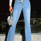 Stylish model wearing Bella Road Denim's light wash raw hem bootcut jeans, showcasing pockets and a trendy belt.