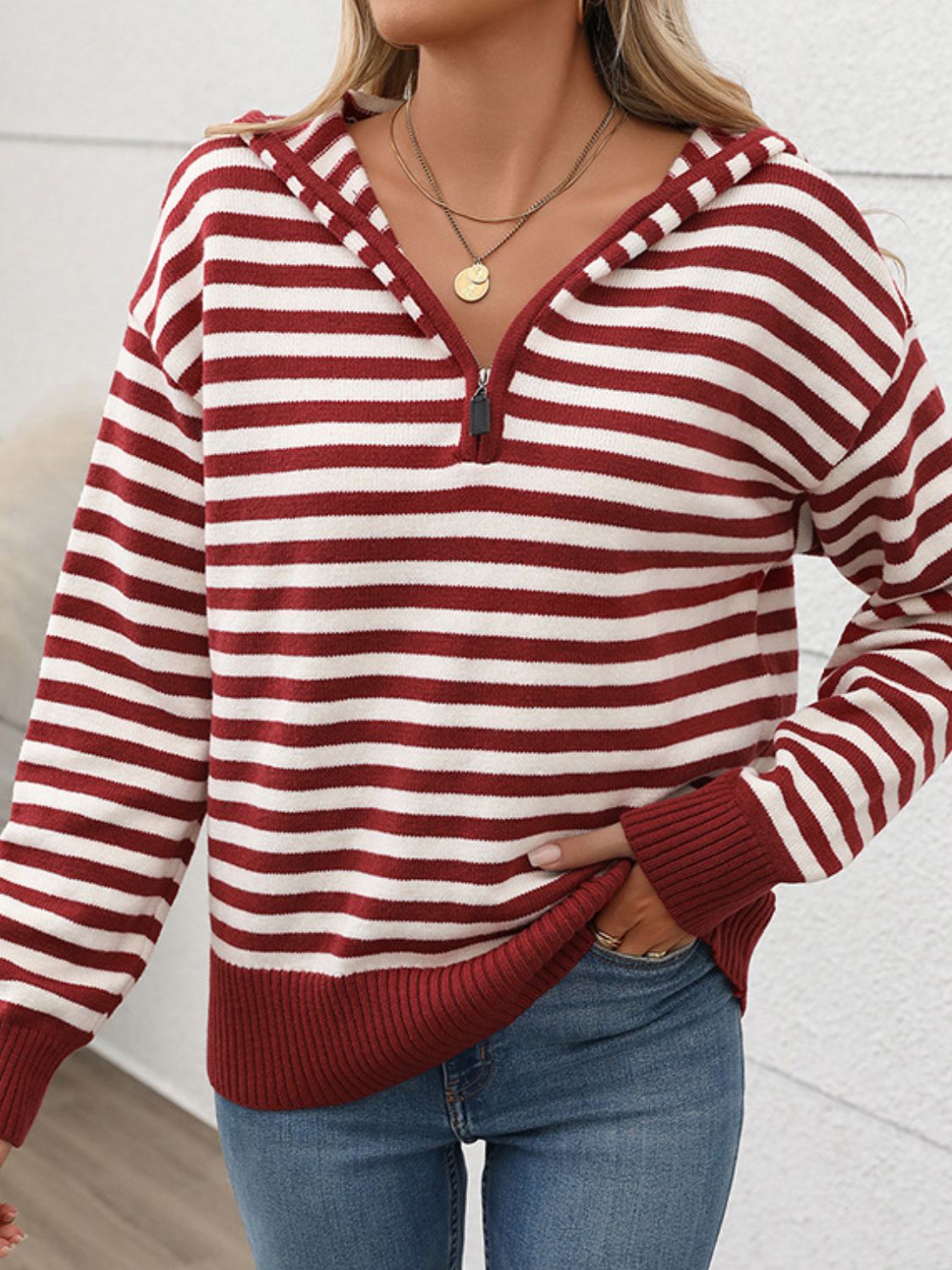 Cozy burgundy striped long sleeve hooded sweater for chilly days, adding fun to any outfit. Perfect blend of acrylic and polyamide.