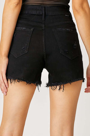 Back view of Risen Jeans frayed hem denim shorts with fringe detail pockets, perfect for summer chic and casual style.