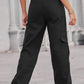 Woman wearing Baeful Long Straight Leg Jeans with Pockets in black, showcasing rear view of chic and comfortable casual style.