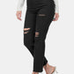 Black distressed cropped jeans with raw hem, styled casually with white heels and a long-sleeve top, perfect for edgy fashion looks.