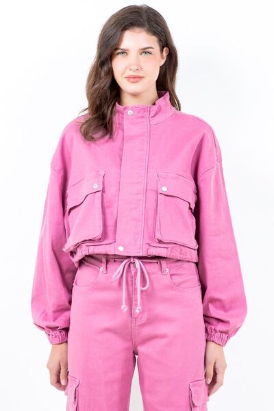 Stylish pink cropped worker jacket with drawstring hem and cargo pockets for a trendy utilitarian look.