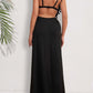 Woman wearing backless tassel surplice spaghetti strap cover-up dress in black, showcasing the back view.