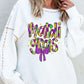 Bella Road MARDI GRAS white sweatshirt featuring colorful text and a bow, perfect for festive celebrations.