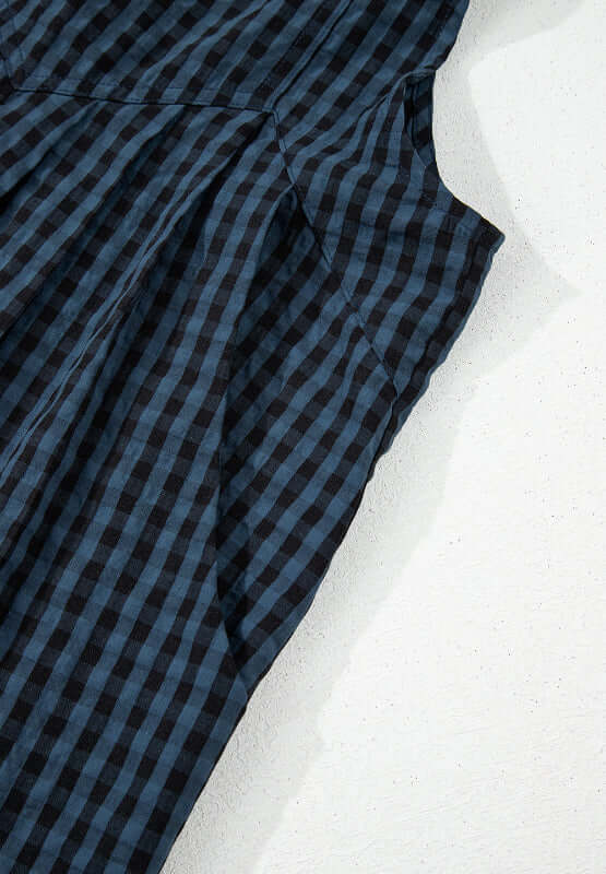 Bella Road plaid wide leg overalls fabric detail in black and blue check pattern.