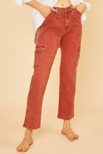 Stylish straight leg jeans with cargo pockets in rust color, perfect for casual and outdoor activities.