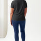 Woman wearing Simply Love STAY SPOOKY Graphic Round Neck Short Sleeve Tubular T-Shirt with relaxed fit, back view.