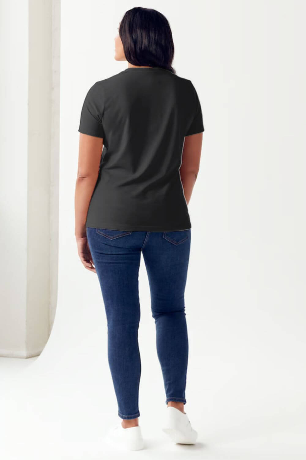 Woman wearing Simply Love STAY SPOOKY Graphic Round Neck Short Sleeve Tubular T-Shirt with relaxed fit, back view.