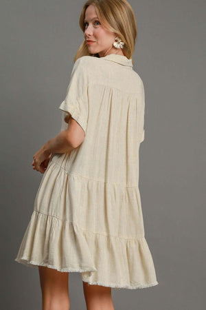 Umgee plus size raw hem tiered dress with folded sleeves, showcasing a flowy silhouette and stylish casual vibe.